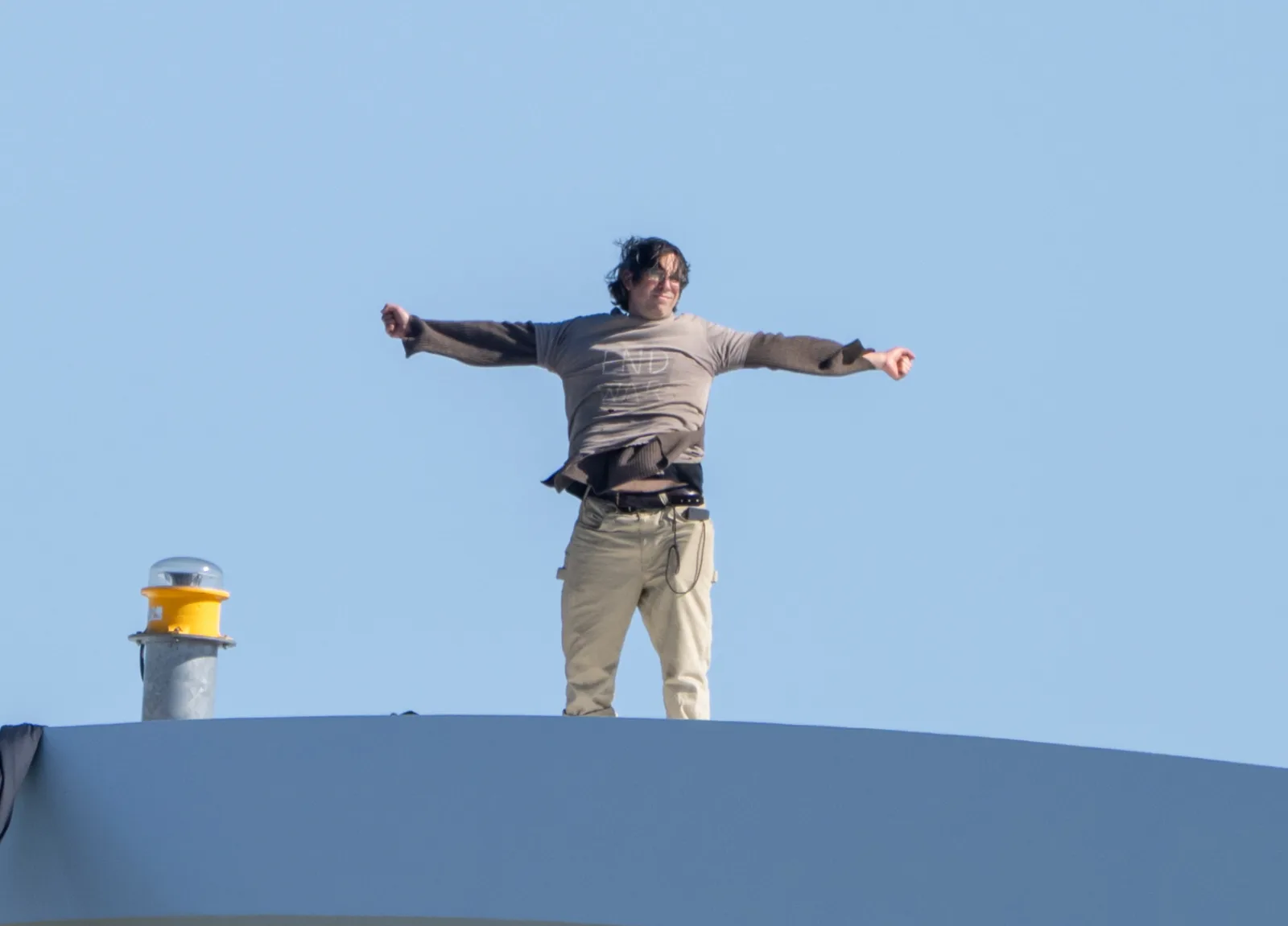 Activist Protests Iran War and AI From Atop Washington's Frederick Douglass Bridge