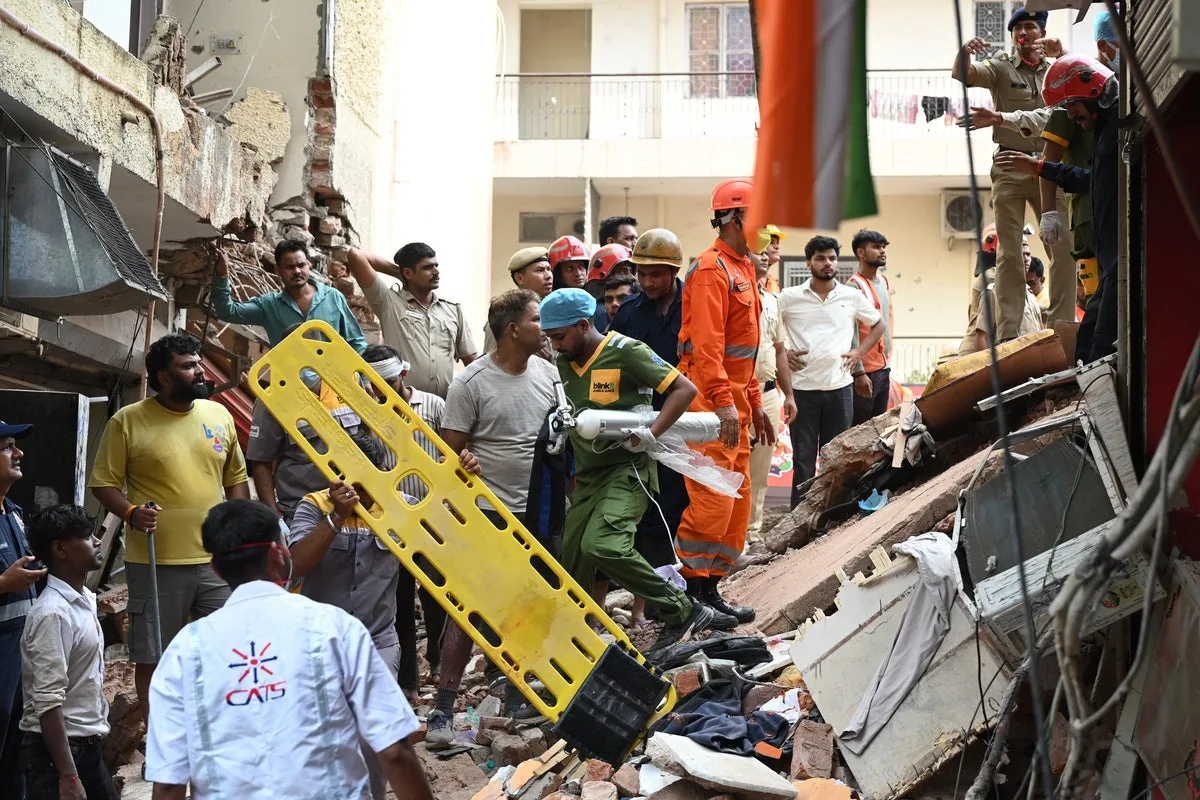 Building Collapse in New Delhi Leaves One Dead and Dozens Feared Trapped