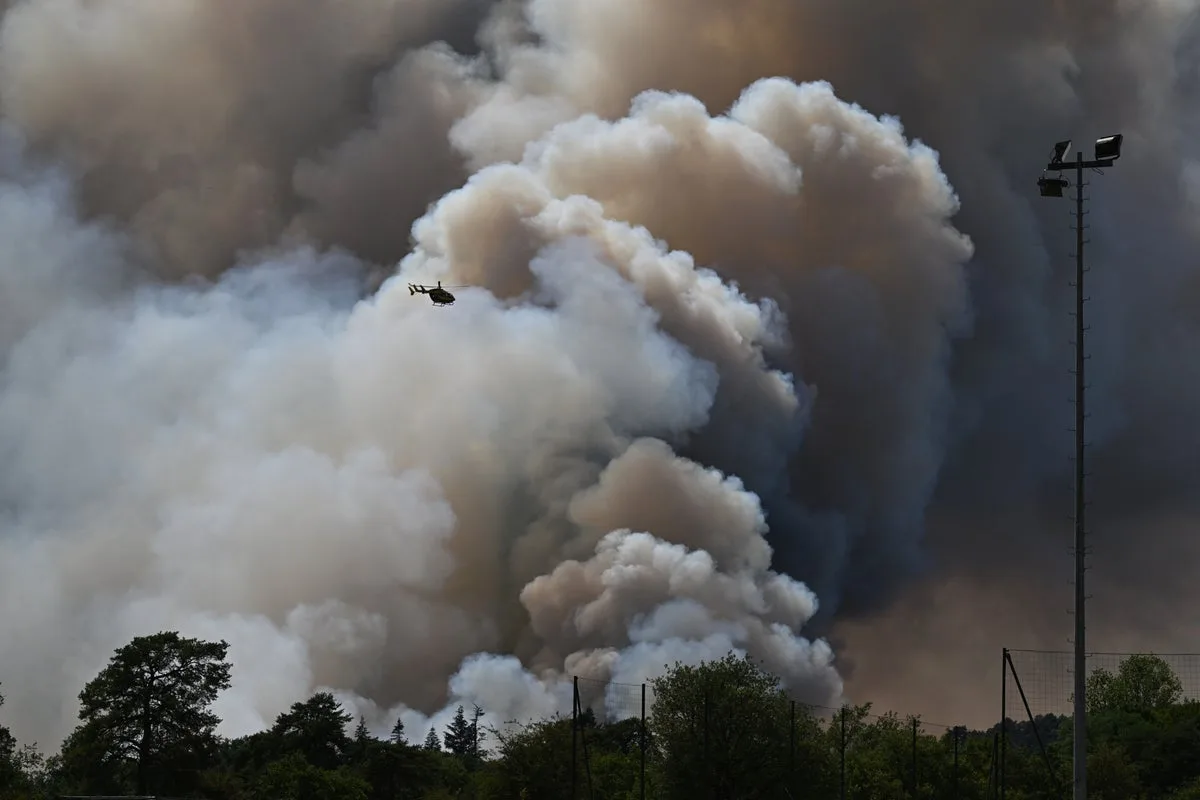 Over 300,000 Evacuated as Wildfires Spread Across Spain and France