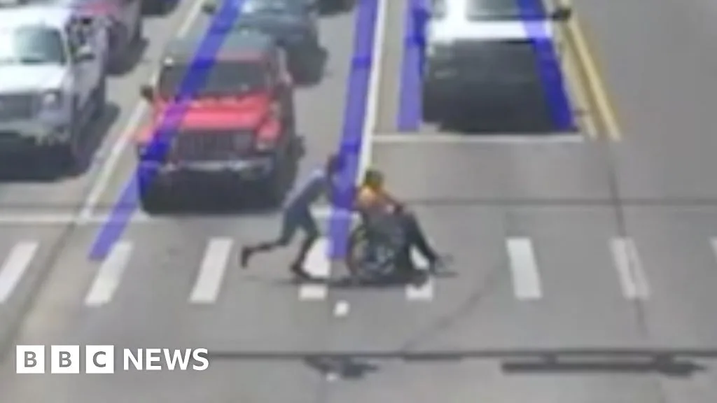 Man Dressed as Spider-Man Helps Wheelchair User Cross Busy Road