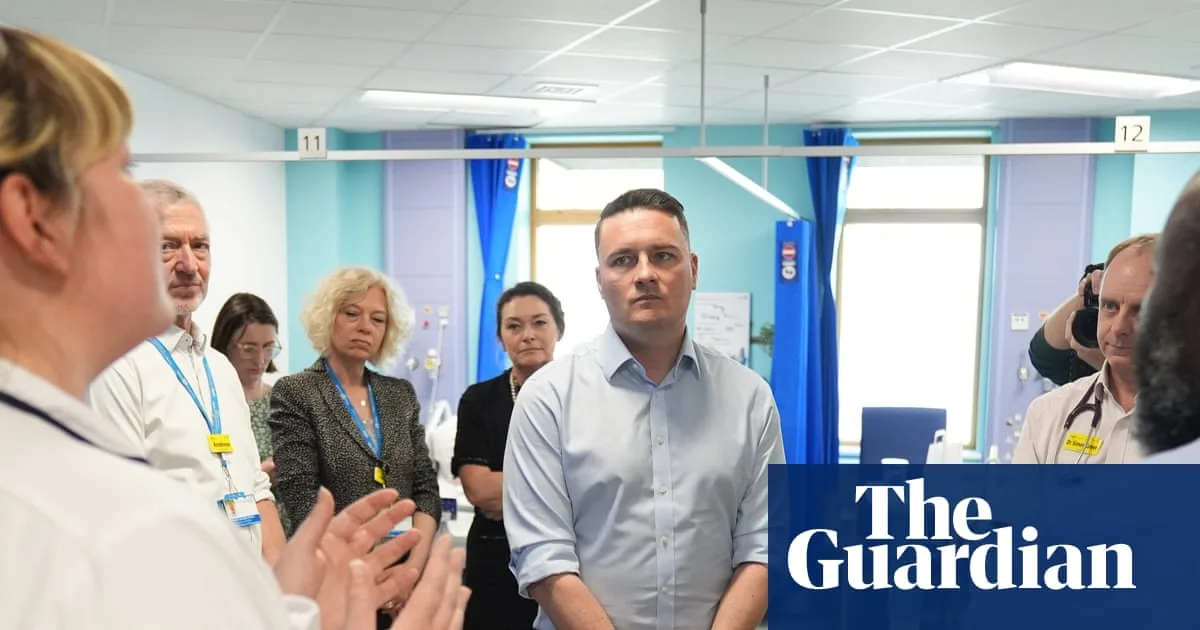 NHS Faces Job Cuts and Funding Crisis Amid Debate Over Insurance Models