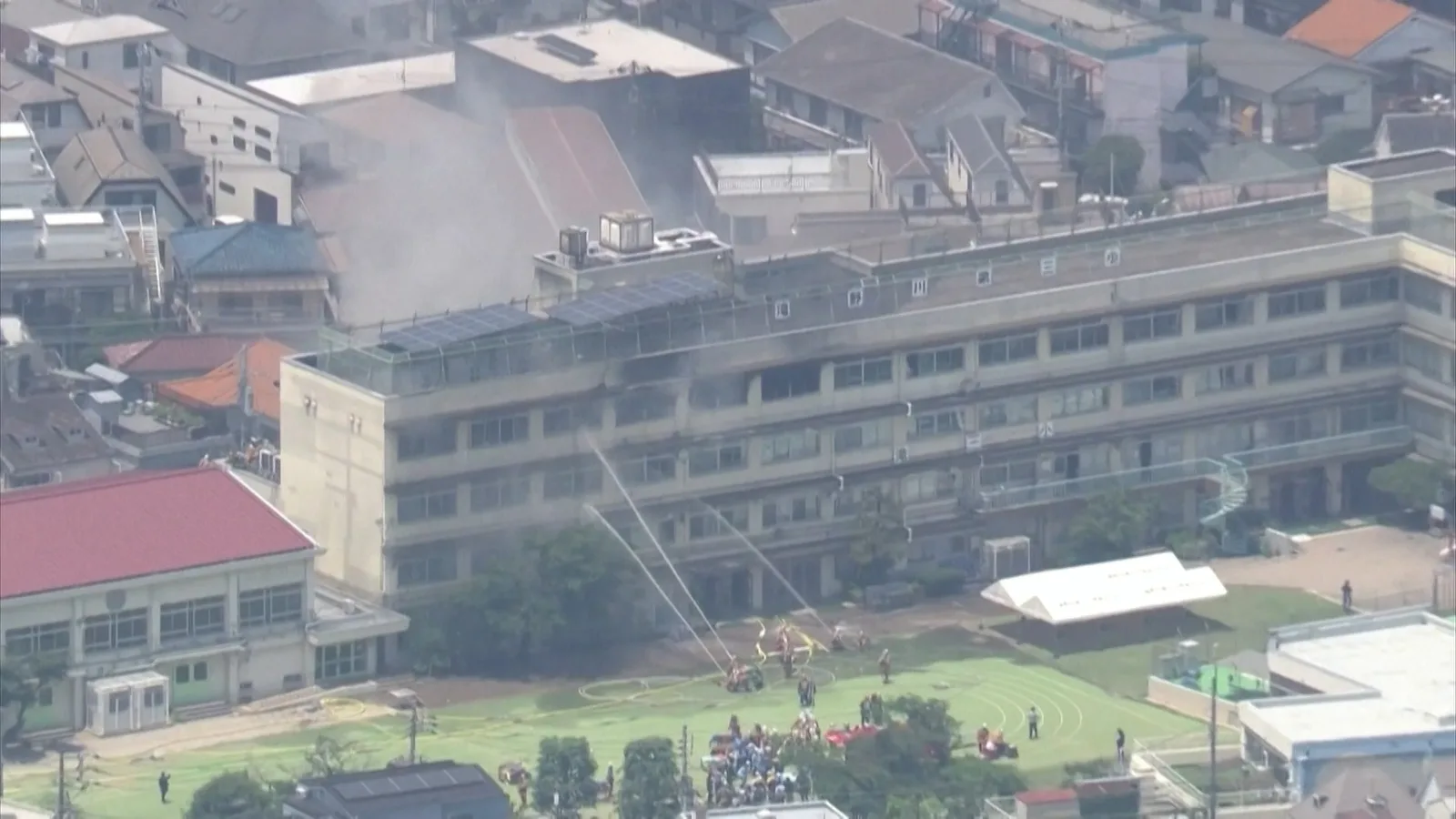 Schoolchildren Wait on Ledge During Fire at Tokyo Primary School