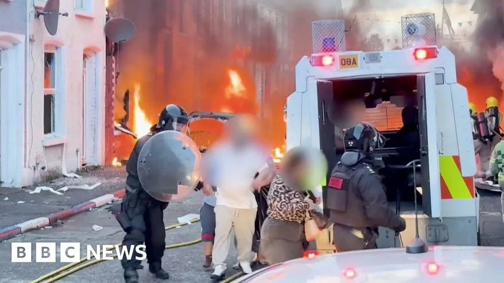 Violent Protests Erupt in Belfast After Knife Attack; Homes and Cars Set on Fire