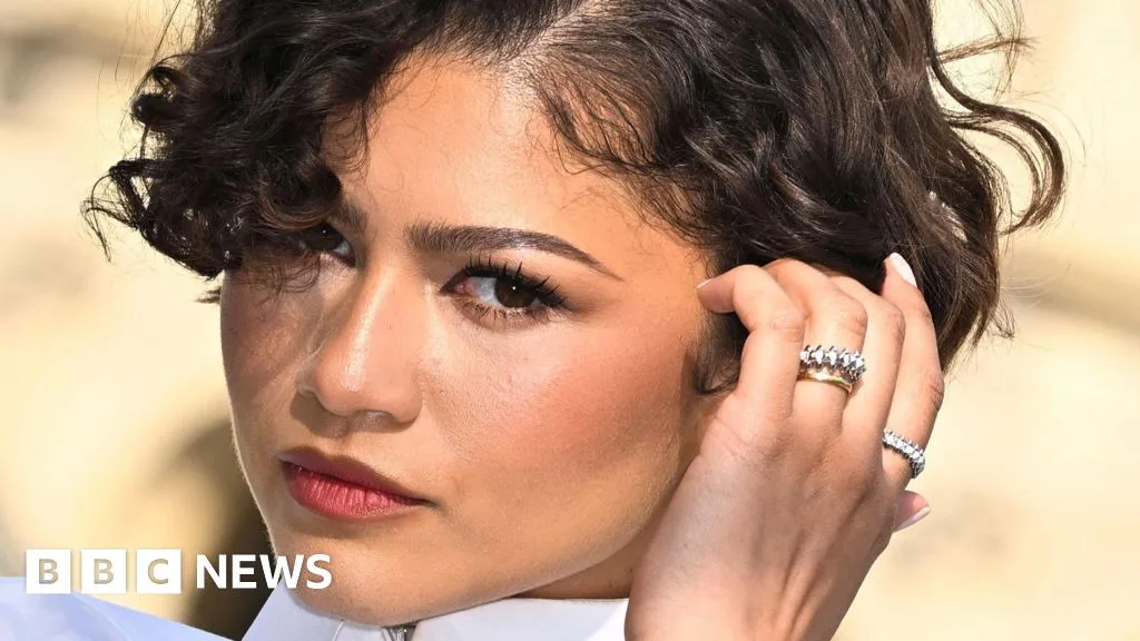 Zendaya Wears Gold Band at Paris Fashion Week Event